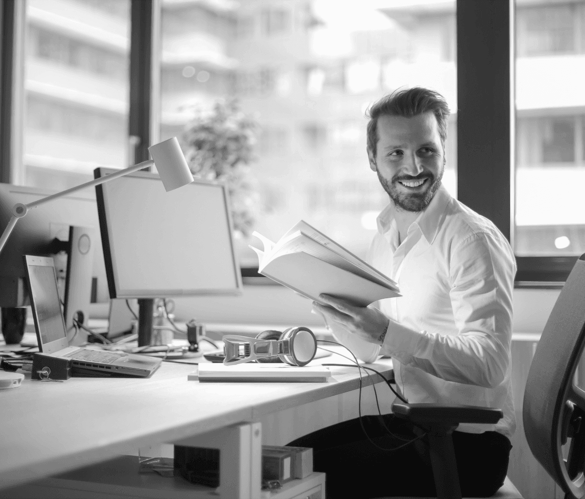 a busy accountant sitting on a desk and auditing a startup's tax filing